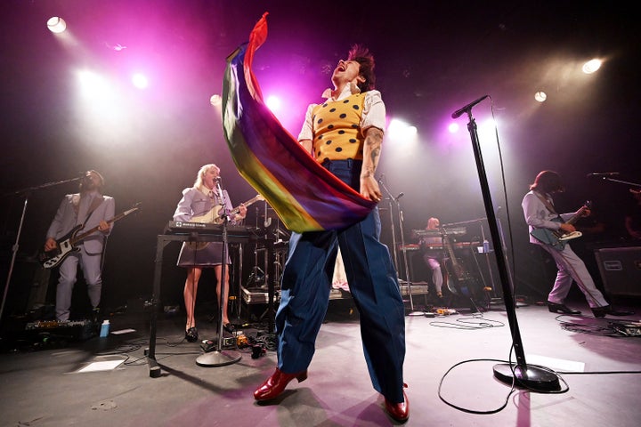 Styles dug into his back catalog to perform One Direction's "What Makes You Beautiful," after which he waved a rainbow LGBTQ Pride flag. 