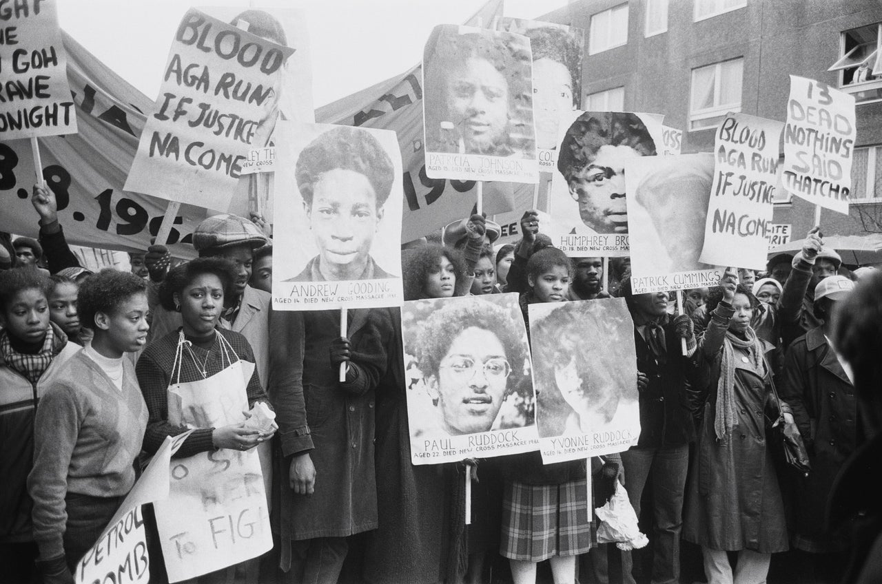 Violence broke out as thousands of angry demonstrators marched through London to protest against the police handling of the investigation into a fire in Deptford in which 13 black people died.