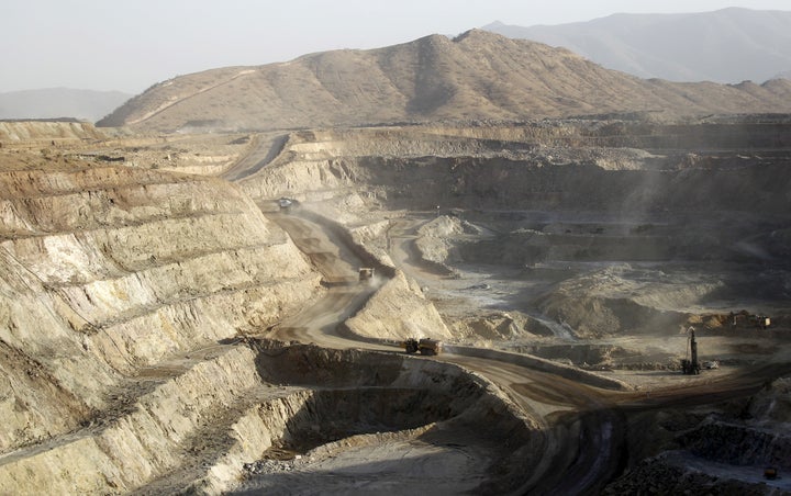 Trucks ferry excavated gold, copper and zinc ore from the main mining pit at the Bisha Mining Share Company in Eritrea, operated by Canadian company Nevsun Resources, on Feb. 17, 2016.