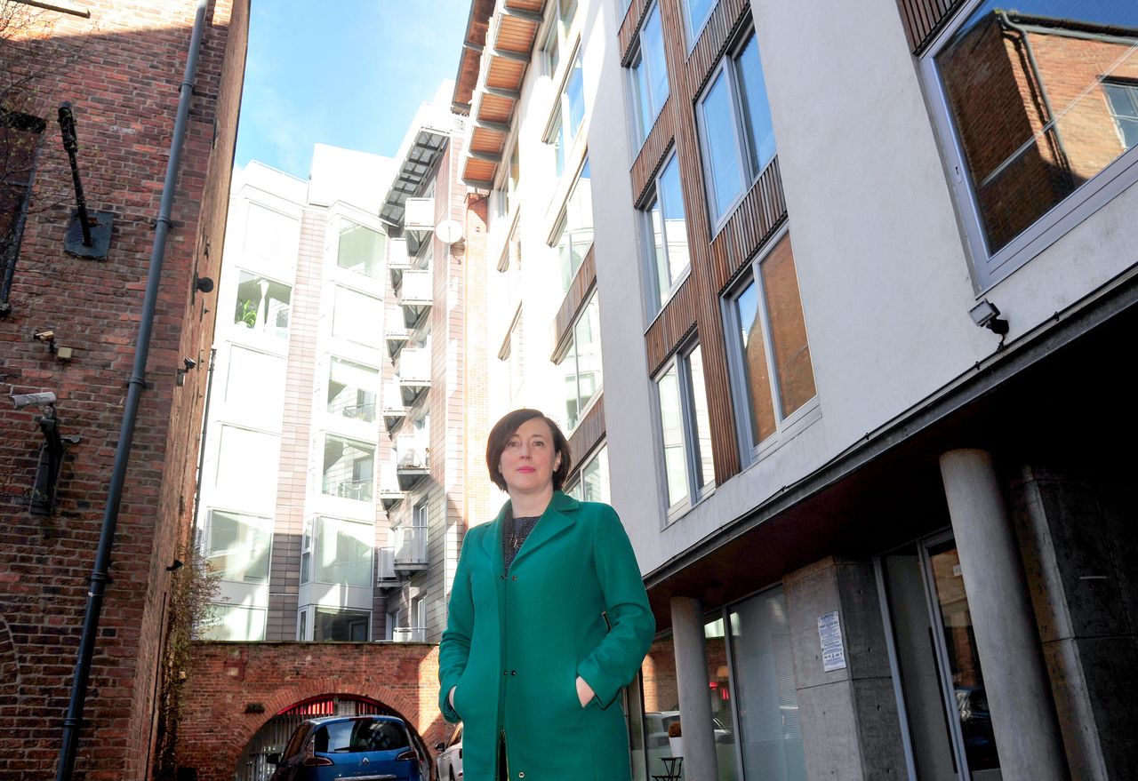Rachael Loftus outside her apartment block in Leeds which has to pay for round-the-clock patrols or face a prohibition notice.