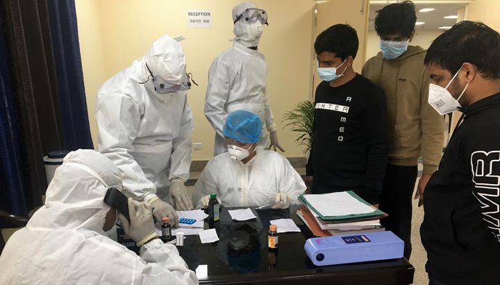 This handout photo provided by the Indo-Tibetan Border Police shows Indian nationals, airlifted from coronavirus-hit Hubei province of China's Wuhan, undergo tests inside a quarantine facility at the Chhawla area of New Delhi. 