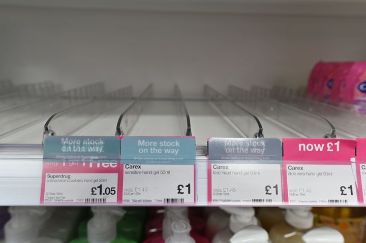 Empty shelves where hand sanitiser gels have sold out in a high street pharmacy in London