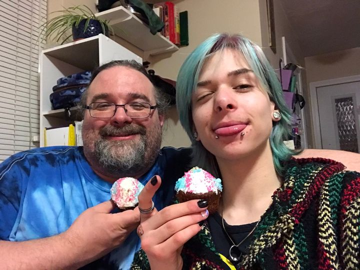 David Scott and his son, Jaden, with cupcakes featuring the transgender flag.