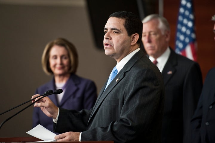 Rep. Henry Cuellar (D-Texas) speaks as House Speaker Nancy Pelosi (D-Calif.) looks on. Pelosi has supported Cuellar despite h