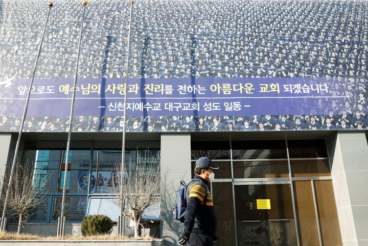 A man wearing a mask walks past a branch of the Shincheonji Church of Jesus amid a rise in confirmed cases of the novel coronavirus disease COVID-19 in Daegu, South Korea, March 2, 2020.