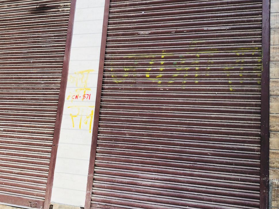 The words Jai Shri Ram was painted on store shutters to identify them as Hindu. A Muslim resident said that it was also painted over Muslim shop to save it from rioters. 