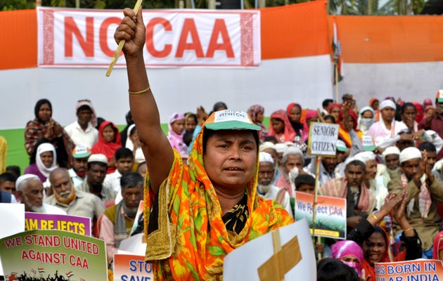 Women participate in a rally to protest the Citizenship Amendment Act (CAA) at Rupahi in Nawgaon, Assam,...