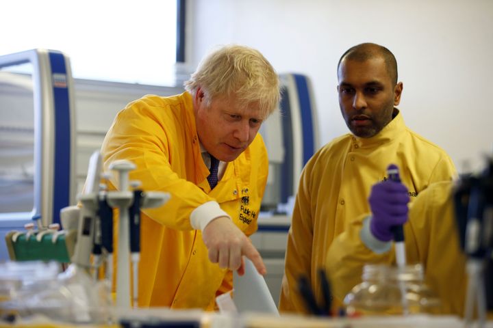 Boris Johnson meets with staff in a laboratory at the Public Health England National Infection Service in Colindale. 