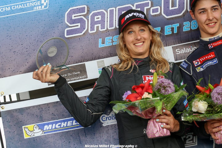 Charlie Martin stands on the podium in France.