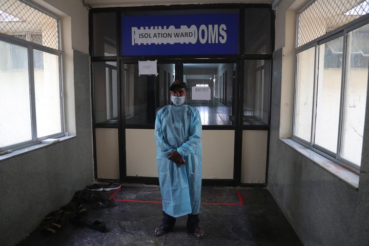 A security man stands in front of an isolation ward where people who returned from China are under observation at the Government Gandhi Hospital in Hyderabad, March 2, 2020.