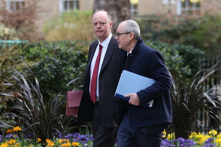 Chief medical adviser to the UK government Chris Whitty (left) and the chief scientific adviser to the UK government Patrick Vallance (right) arrive in Downing Street on March 3, 2020.