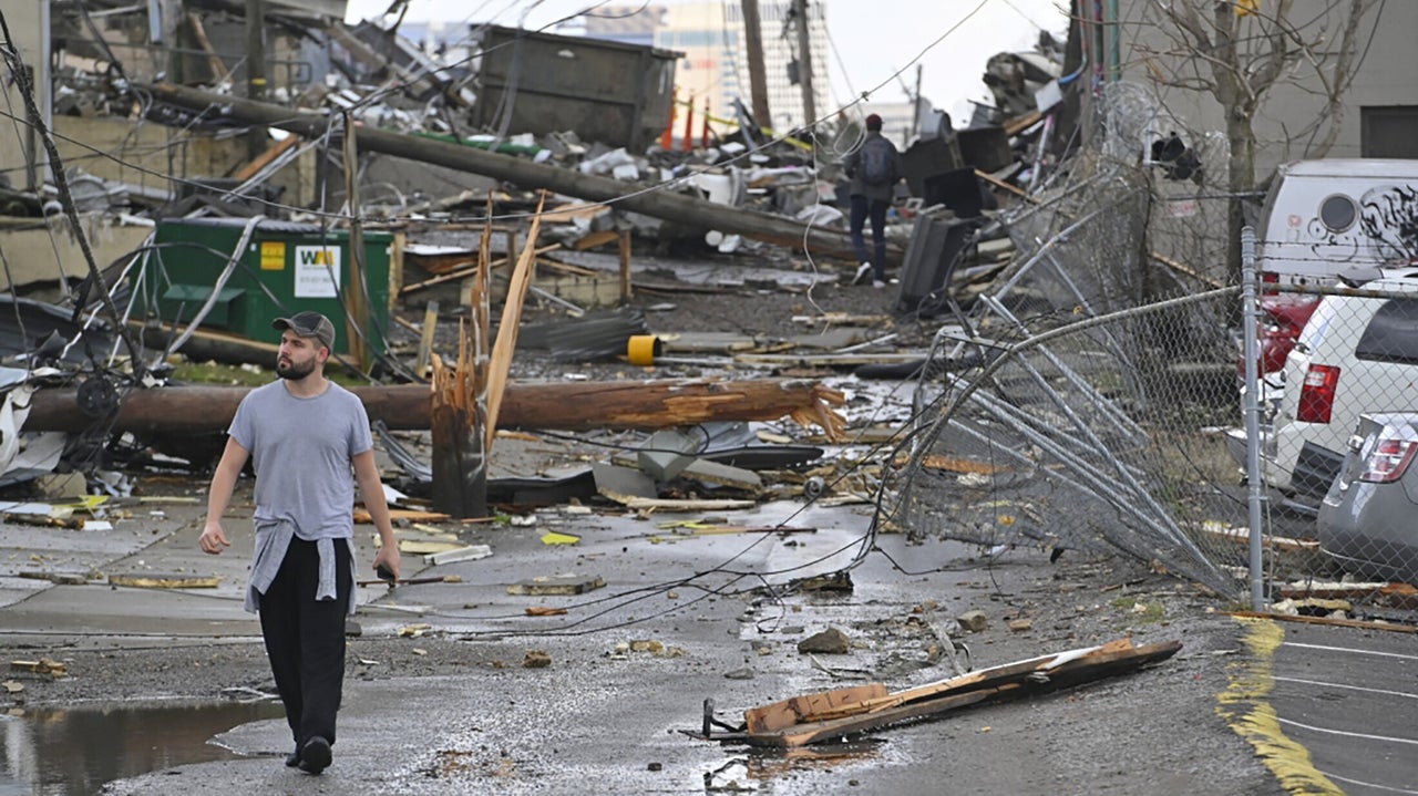 A man views damage in an alley behind Woodland Street after a tornado touched down in Nashville, Tennessee, U.S. March 3, 2020. REUTERS/Harrison McClary