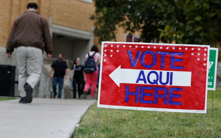 A sign shows the way to the polling station at Austin Community College on Nov. 4, 2014 in Austin, Texas. Voters headed to th