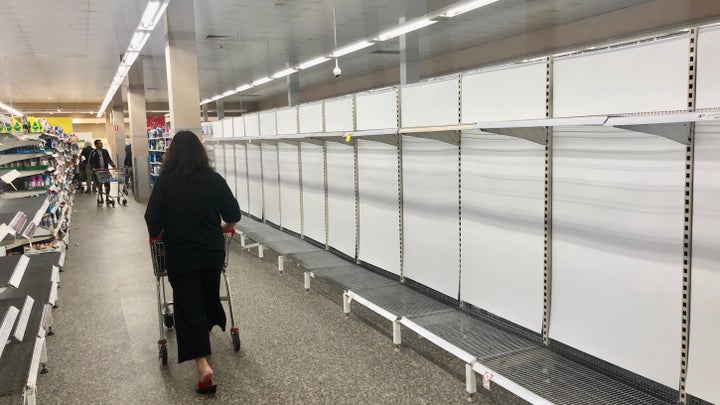 Shelves where disinfectant wipes ,toilet tissues, bottled water, flu medicines are usually displayed are nearly empty at a local store on March 03, 2020 in Rhodes area ,Sydney, Australia. As fear of the Coronavirus are spreading, people are buying above products in abundance. (Photo by Izhar Khan/NurPhoto via Getty Images)