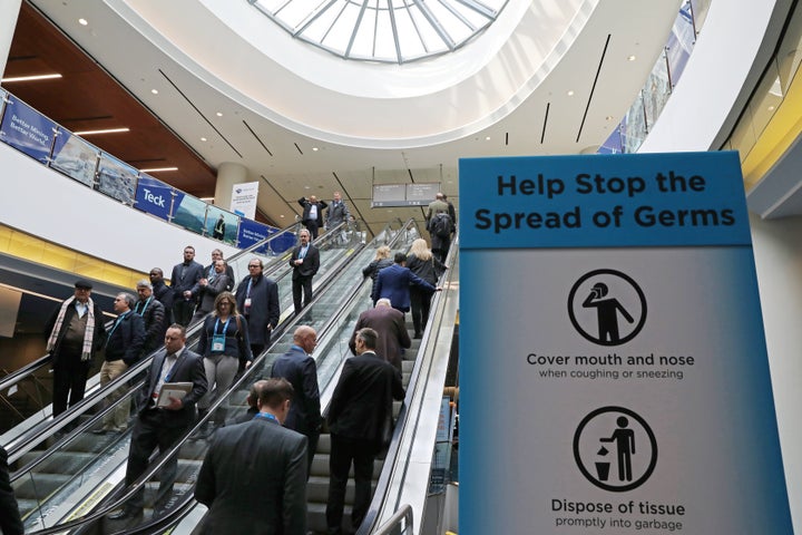 A sign warning about the spread of germs is shown at a conference in Toronto on Mar. 1, 2020.