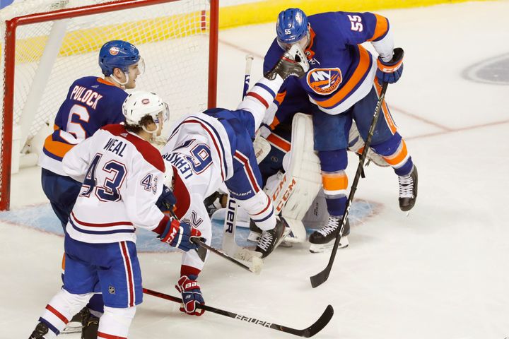 Johnny Boychuk takes a skate to the face as Montreal Canadiens left wing Artturi Lehkonen falls.