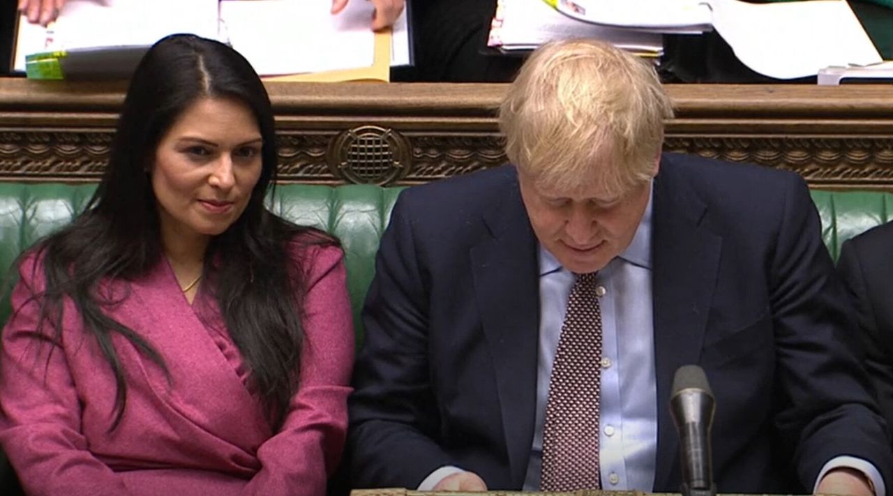Patel sat next to Johnson as he defended her at PMQs on Wednesday