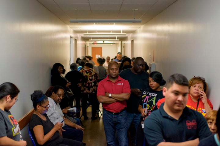 Voters line up at a polling station during the presidential primary in Houston on March 3, 2020.