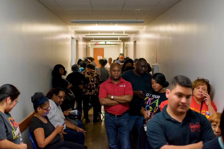 Voters line up at a polling station during the presidential primary in Houston on March 3, 2020.