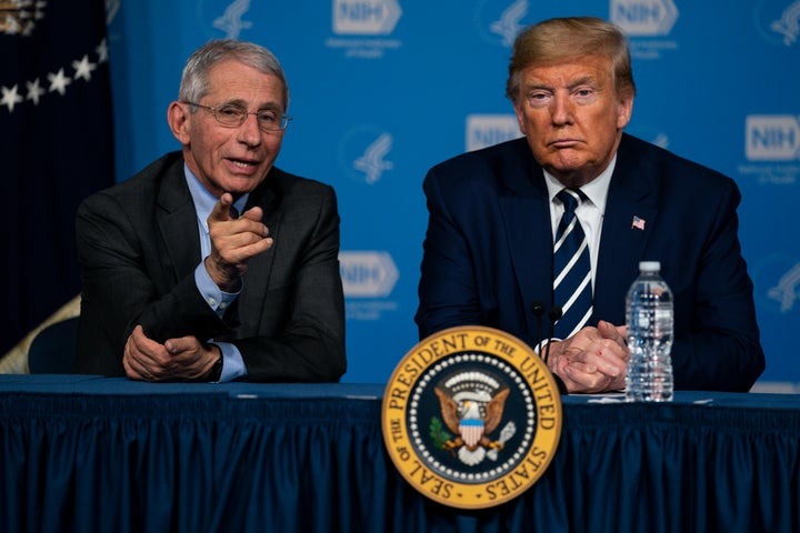 President Donald Trump listens to Dr. Anthony Fauci, director of the National Institute of Allergy and Infectious Diseases, during a briefing on the coronavirus at the National Institutes of Health on March 3 in Bethesda, Maryland.