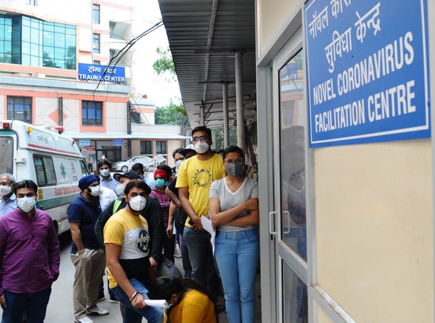 People People queue up at a COVID screening center at Ram Manohar Lohia Hospital