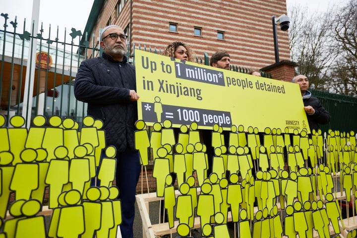 Human rights activists display dolls which they say depicts thousands of missing ethnic Uighurs outside the Chinese embassy on March 5, 2020 in The Hague, Netherlands. 