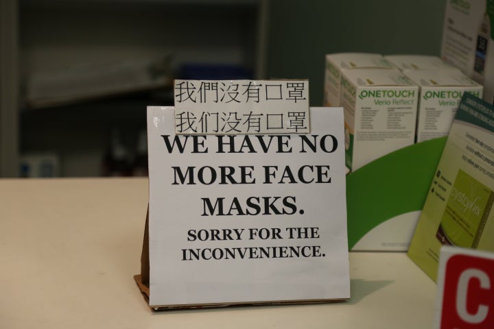 A sign at a pharmacy is seen here in Vancouver on Jan. 28. Pharmacists are already seeing heightened demand for over-the-counter items like masks and hand sanitizers.