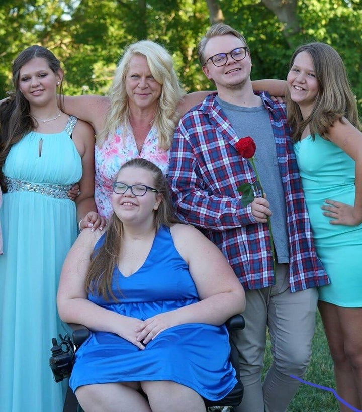 Christine (second to the left), Emma (centre), and her siblings all have varying degrees of mitochondrial disease. Emma and her brother deal with the most severe symptoms. Her mother, as a carrier, experiences fatigue.