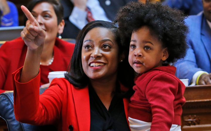 Virginia state Del. Jennifer Carroll Foy (D), holding her son, is running for governor. 