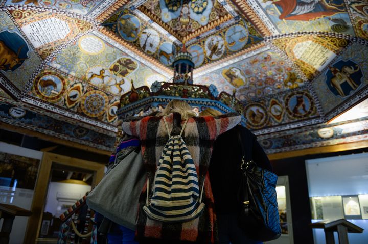 Visitors observe a preserved synagogue inside an exhibit room at Poland's POLIN Museum on Feb. 19 in Warsaw.