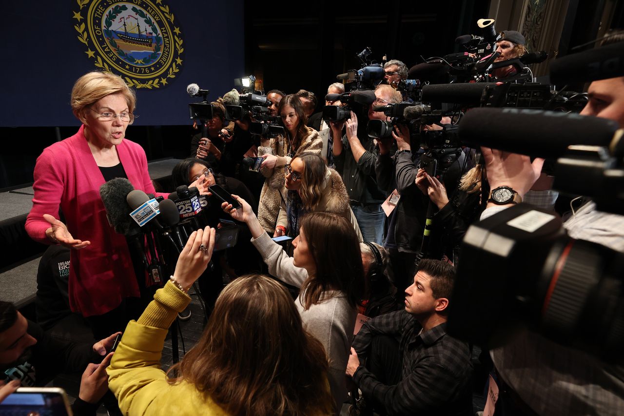 Elizabeth Warren speaks to reporters following a town hall in Keene, New Hampshire, in the run-up to the state’s primary. Warren spoke to reporters nearly every day she was on the campaign trail, but did not answer their questions about polls.