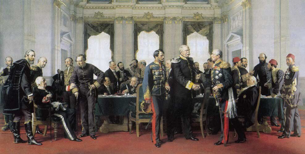 Η πρώτη συνάντηση των πληρεξούσιων των διαφόρων χωρών στο συνέδριο του Βερολίνου. Πίνακας του Άντον φον Βέρνερ (1884) (Δημαρχείο Βερολίνου). Εικονιζόμενοι από αριστερά: ο Βαρώνος Χάυμερλε, Καρόλυ, Λωναί, Γκορτσακώφ (καθιστός), Βάδικτον, Κόμης του Μπήκονσφηλντ, καθιστοί στο γραφείο οι Ρόδοβιτς και Ουμπρίλ και πίσω τους οι Χοενλόε, Μουρ, Κόρτη και Ντεπρέ, μπροστά ένστολος ο Κόμης Ιούλιος Αντράσυ και πίσω του ο Μπρούχερ ο πρίγκιπας Βίσμαρκ ανταλλάσσοντας χειραψία με τον Σουβάλωφ και πίσω τους διακρίνονται οι Μπους Χόλσταϊν, δεξιότερα ο Αμπτουλάχ Μπεης και ο Ρούσελ ενώ μπροστά καθιστός ο Μπύλο και δεξιότερα ο Σαλίσμπουρυ ο Καραθεοδωρής πασάς και ο Μεχμέτ Αλή Πασάς.