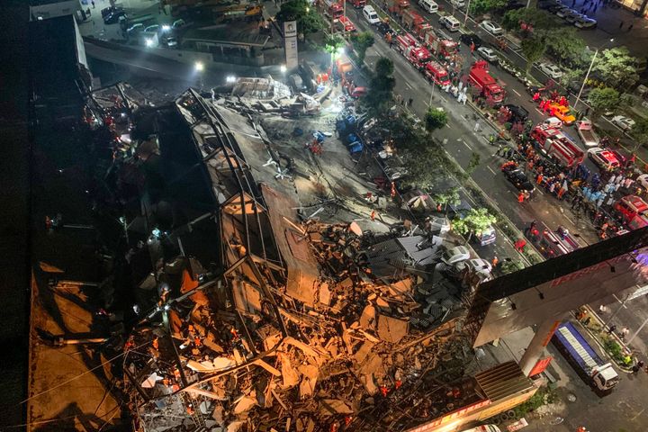 Rescuers search for survivors in the rubble of a collapsed hotel in Quanzhou, in China's eastern Fujian province on March 7, 2020. - Around 70 people were trapped after the Xinjia Hotel collapsed on March 7 evening, officials said. (Photo by STR / AFP) / China OUT (Photo by STR/AFP via Getty Images)