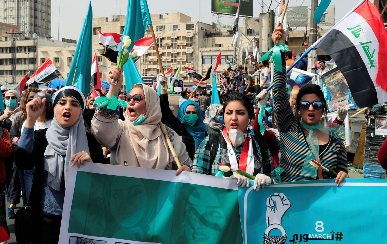 Protesters move through the streets of Baghdad, Iraq to mark International Women's Day. 
