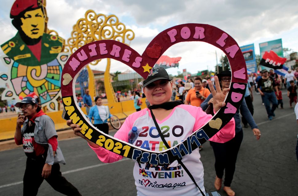 A supporter of Nicaraguan president Daniel Ortega takes part in a march called "Brave Women! Victorious women!" to mark International Women's Day in Managua, Nicaragua.