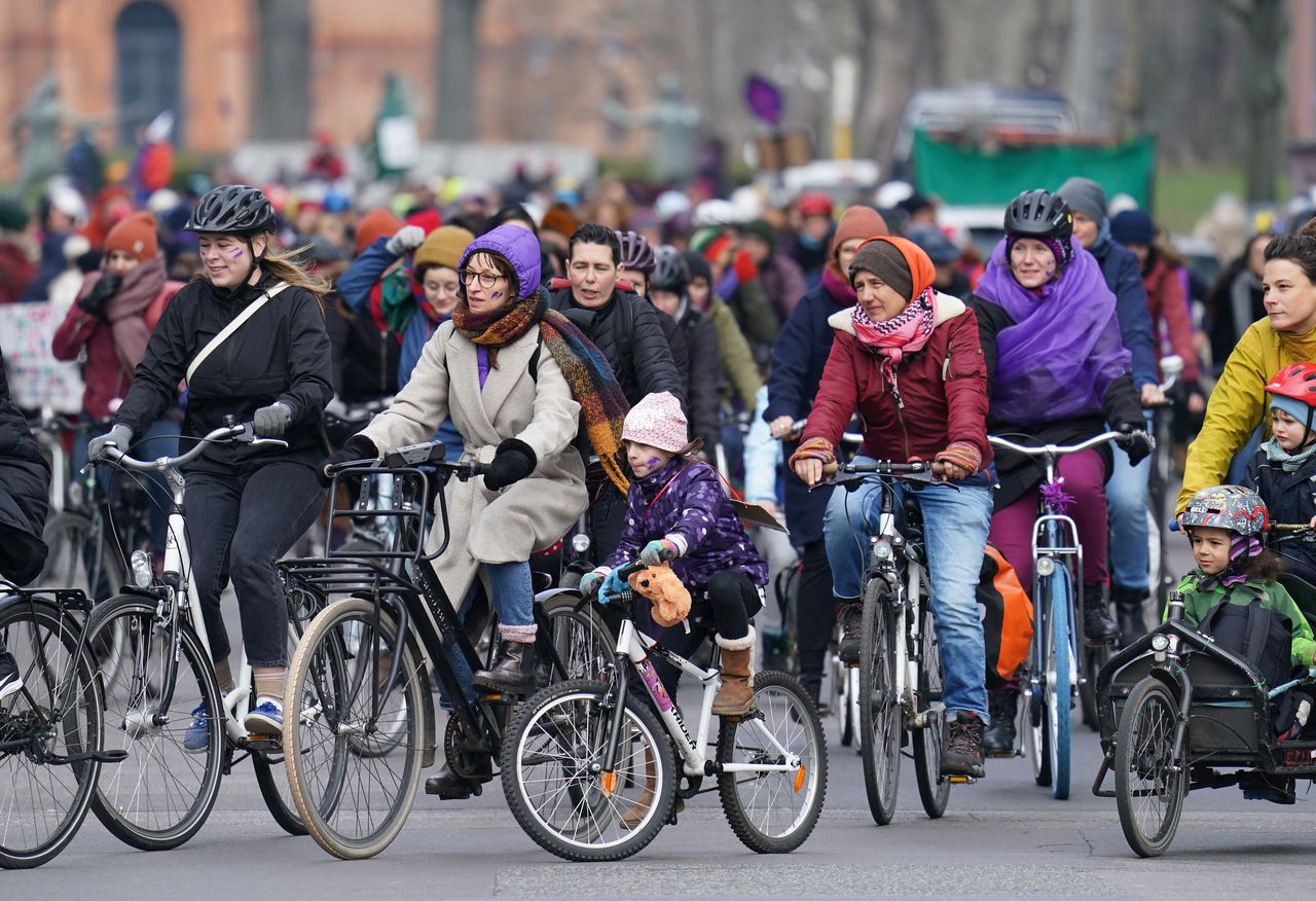 Women riding bicycles participate in the "Purple Ride" feminist women's bicycle protest Berlin, Germany. 