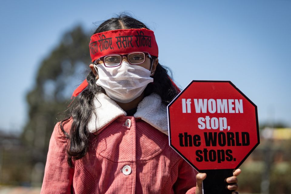 KATHMANDU, NEPAL - 2020/03/08: A woman holds a placard during a protest against gender inequality and sexual violence in Kathmandu, Nepal. 