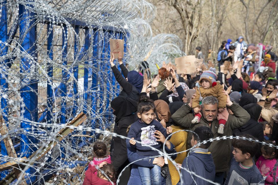 Asylum Seekers, mostly women, waiting at Turkey's Pazarkule border crossing to reach Europe, stage a demonstration at the buffer zone demanding to open the gate during 'International Women's Day', in Erdine, Turkey.  