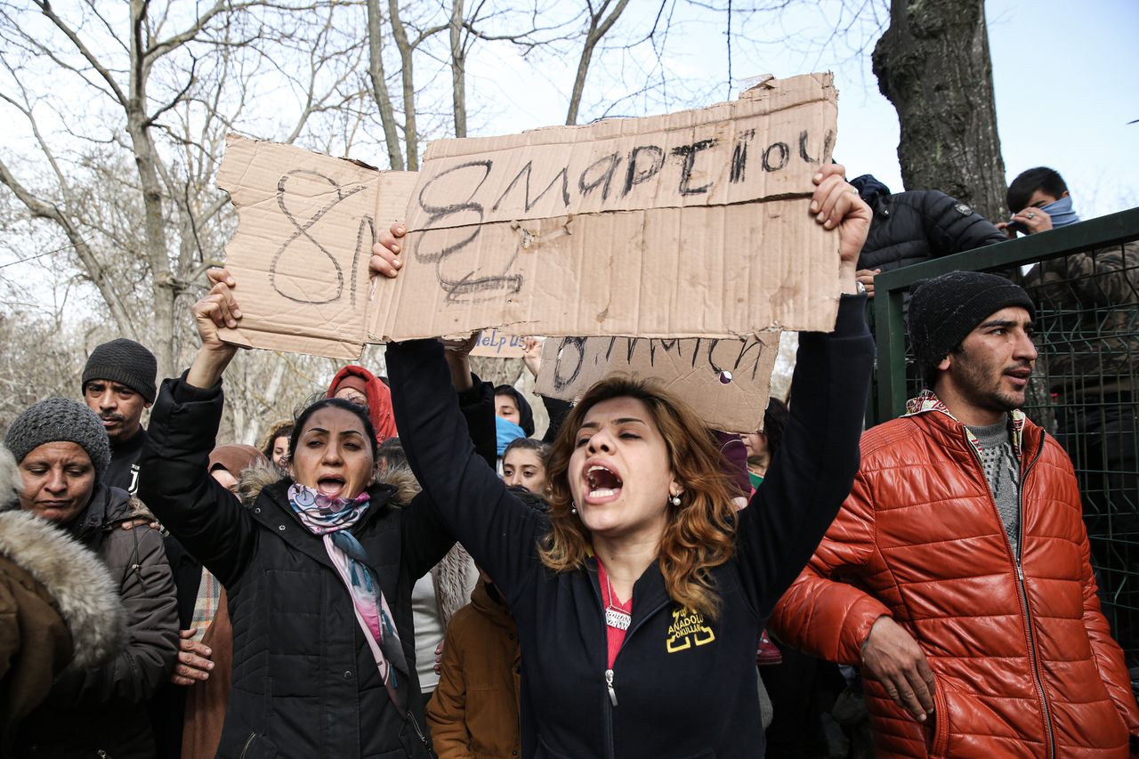 Asylum Seekers, mostly women, waiting at Turkey's Pazarkule border crossing to reach Europe, stage a demonstration at the buffer zone demanding to open the gate during 'International Women's Day', in Erdine, Turkey. 