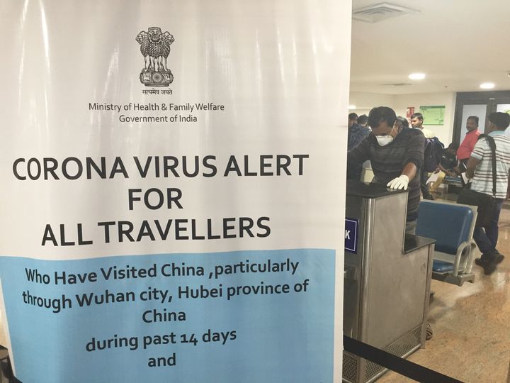Sign warning travelers about the coronavirus at Trivandrum International Airport in Thiruvananthapuram (Trivandrum), Kerala,