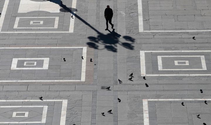 A man walks in Duomo square in Milan, Italy on Sunday.