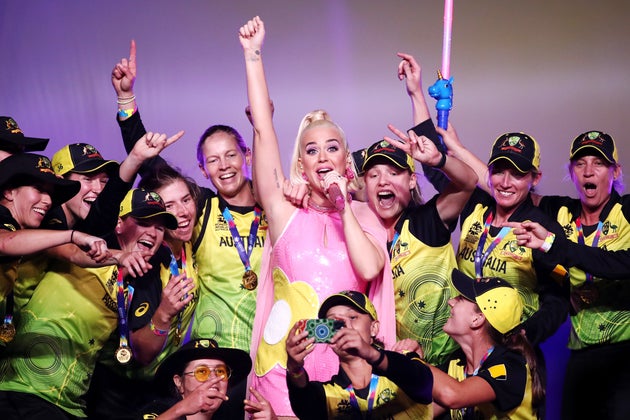 Katy Perry performs on stage with the Australian team during a concert after their victory in the ICC Women's T20 Cricket World Cup Final match between India and Australia at the Melbourne Cricket Ground on March 08, 2020 in Melbourne, Australia.