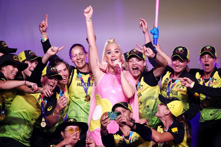 Katy Perry performs on stage with the Australian team during a concert after their victory in the ICC Women's T20 Cricket World Cup Final match between India and Australia at the Melbourne Cricket Ground on March 08, 2020 in Melbourne, Australia. 