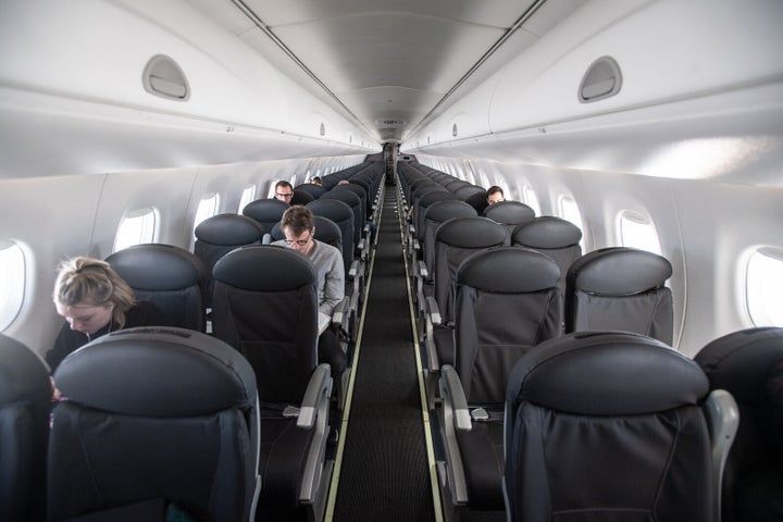 An almost-empty British Airways passenger plane flies from Milan to London on March 5 in Milan, Italy. 