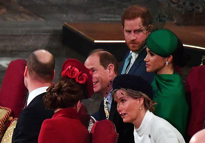 Harry and Meghan sit next to Prince Edward and Sophie, Countess of Wessex, who appear to converse with William and Kate.