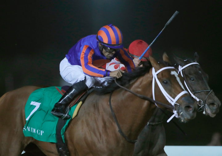 Jockey Luis Saez rides Maximum Security near the finish line of the $20 million Saudi Cup at King Abdul Aziz race track in Riyadh, Saudi Arabia, on Feb. 29.