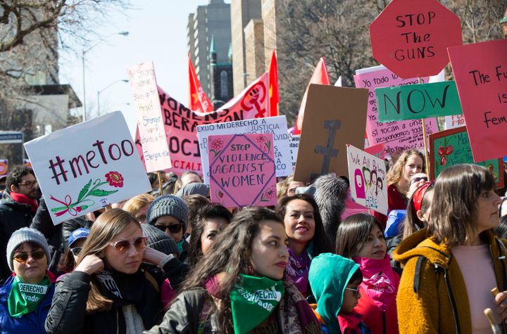 People take part in the 2020 International Women's Day March in Toronto on Sunday.