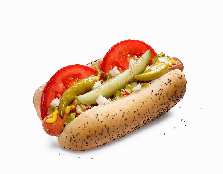 A Chicago-style hot dog, served on a traditional poppyseed roll.