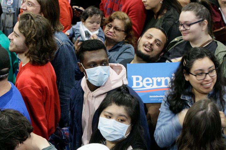 Some supporters wore face masks as they attended a campaign rally for Democratic presidential contender Sen. Bernie Sanders in Los Angeles on March 1.