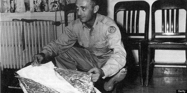 DENVER - UNDATED: Major Jesse Marcel from the Roswell Army Air Field with debris found 75 miles north west of Roswell, NM, in June 1947. The debris has been identified as that of a radar target. The Air Force released a report on 24 June debunking reports of a UFO crash near Roswell, NM, in 1947. (Photo by: UNITED STATES AIR FORCE/AFP/Getty Images)